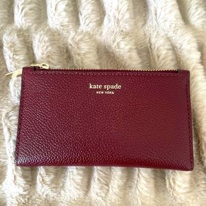 KATE SPADE bifold wallet with 8 card slots and 1 ID slot with zipped coin purse